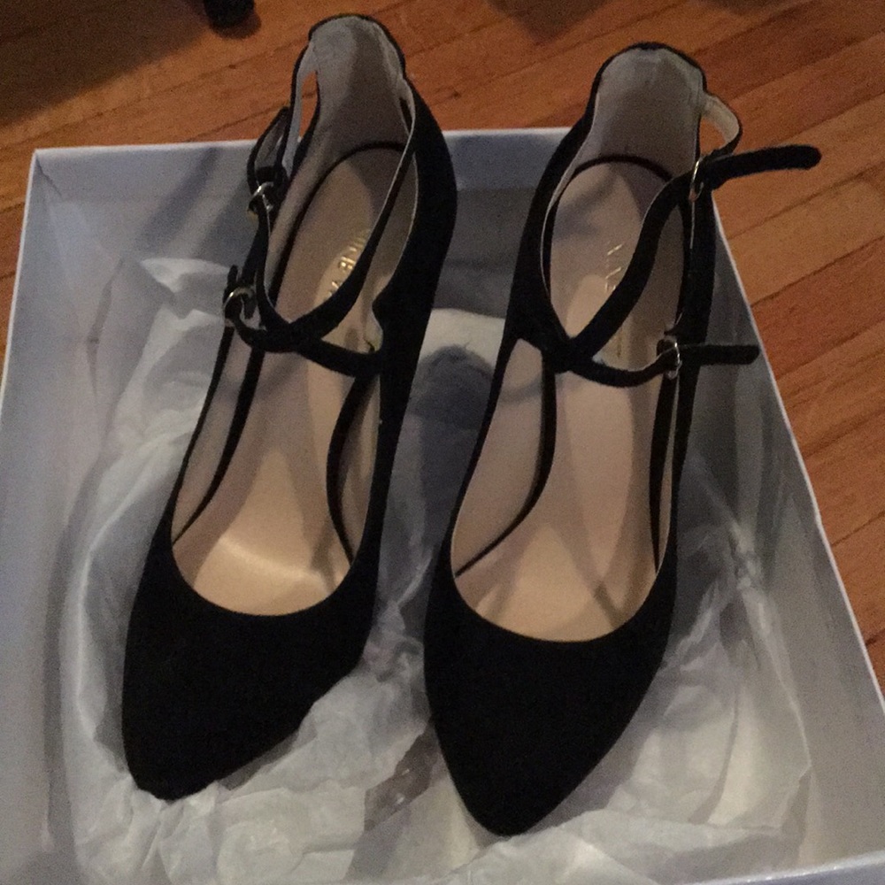 Black cross ankle strap pumps